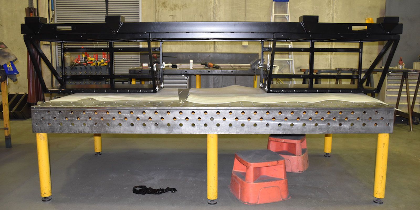 Fleet vehicle modification experts use Demmeler table system for accuracy 