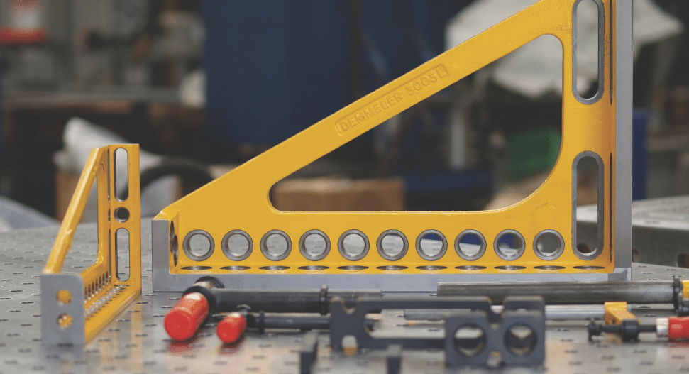 Demmeler clamping angle secured to a custom modular welding table