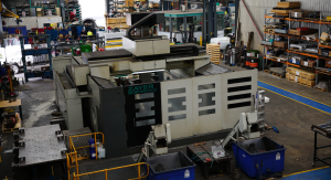 Zayer Memphis 4000U large-format CNC bed milling machine on the floor of a busy industrial machining workshop, viewed from an elevated angle