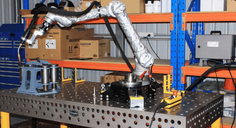 Collaborative robot arm mounted on a Demmeler 3D welding table at Leussink’s Illawarra workshop