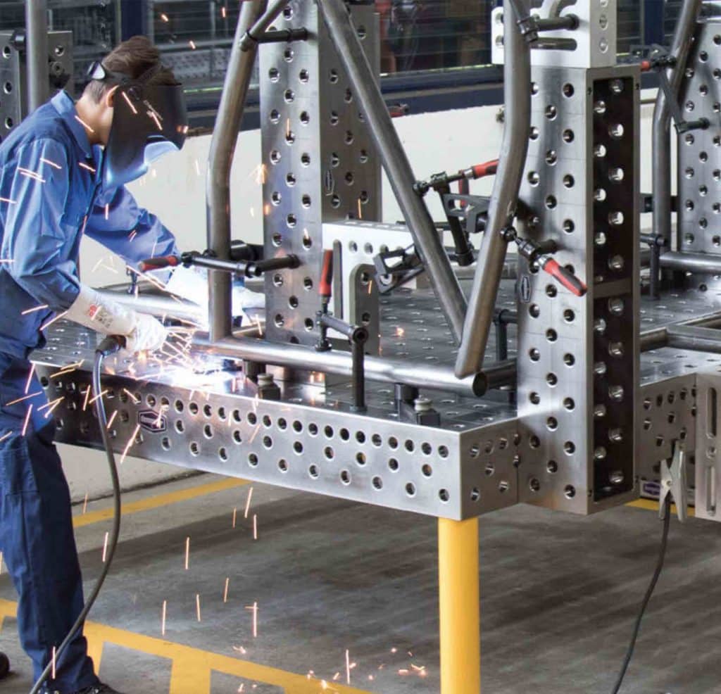 Welder using the Demmeler 1001 welding table in an Australian workshop