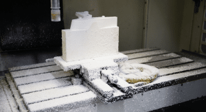 2026 09 Small Parts Machining Blog Hero Small parts CNC machining of white polymer block at Leussink